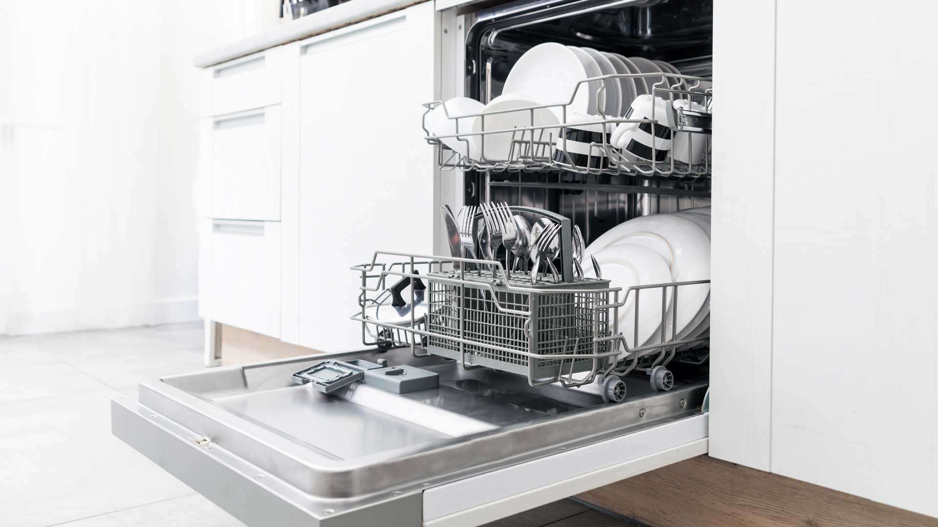 A dishwasher, full of sparkling clean dishes