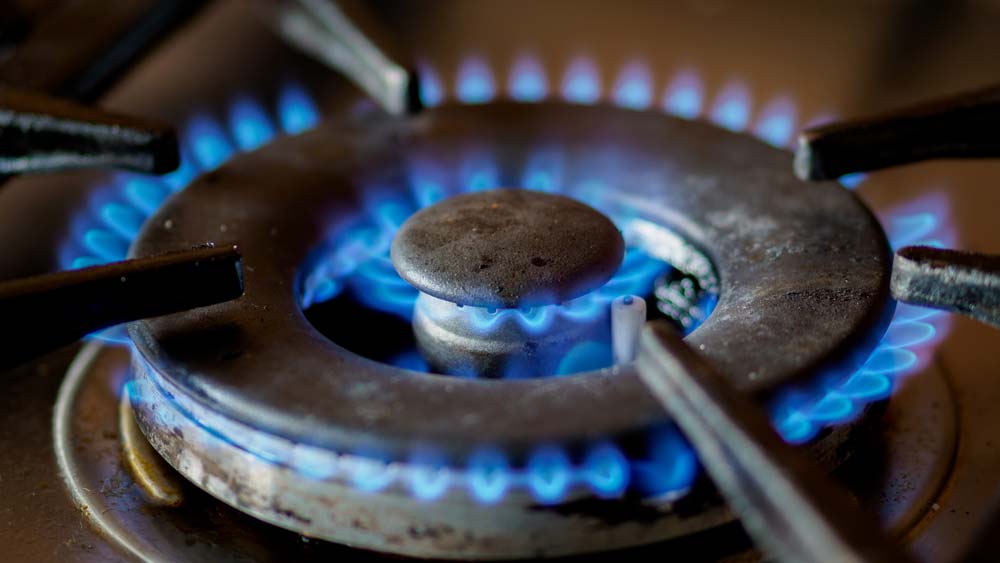 Close-up on a lit gas stove